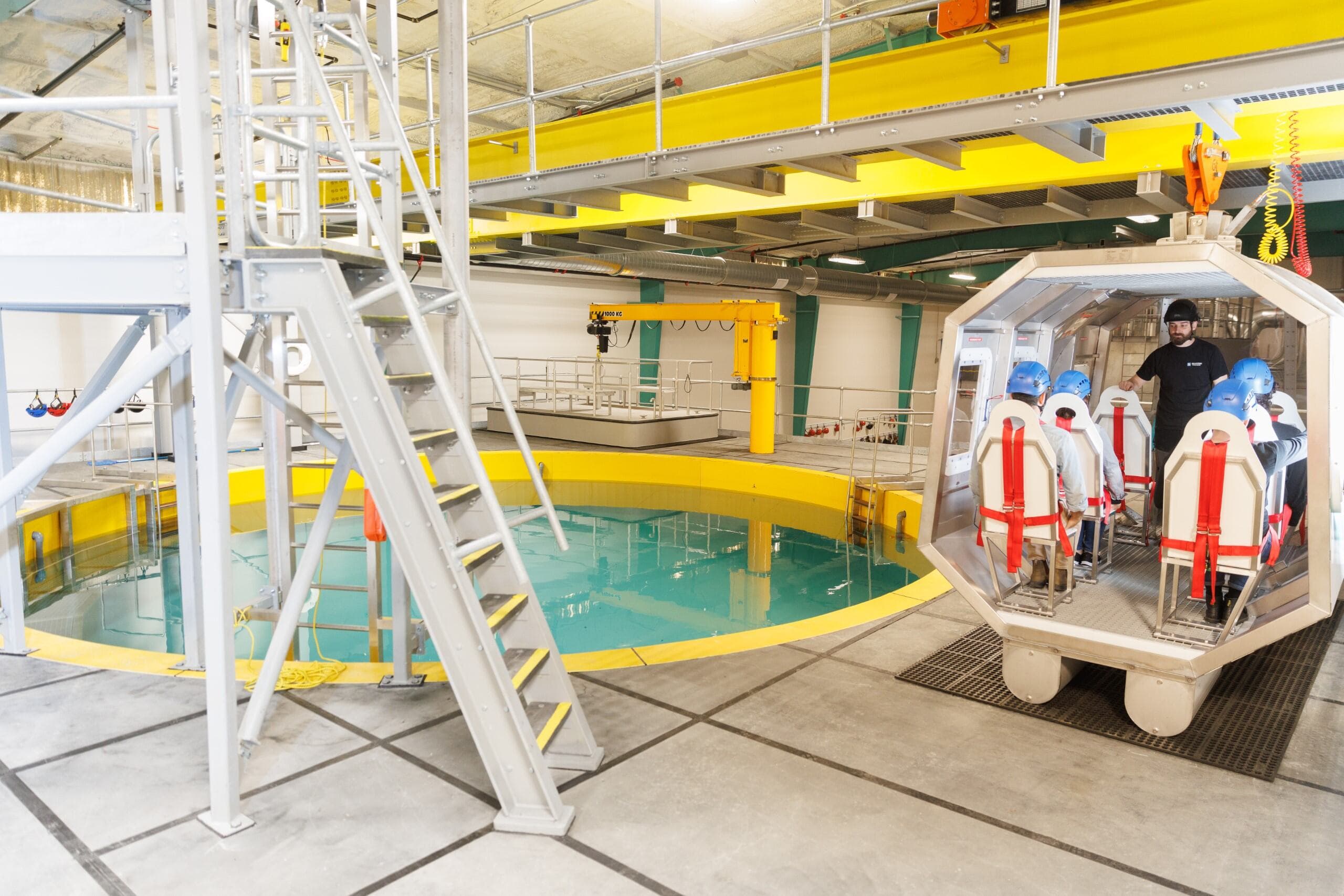 a specialised training facility featuring a water pool and a helicopter evacuation simulator.