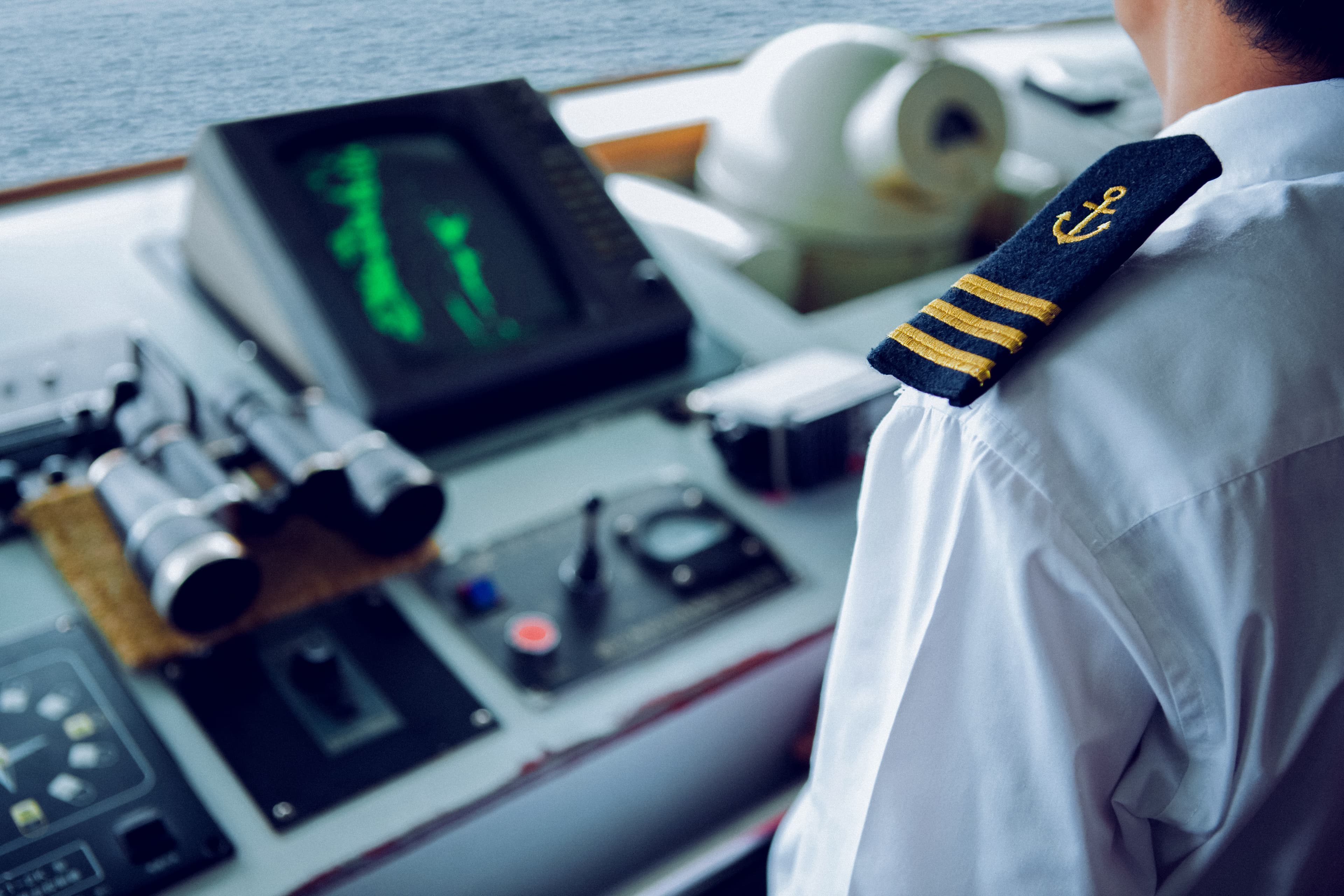 Captain at ships helm